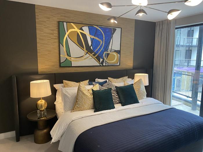 Decorated bedroom with art on the wall